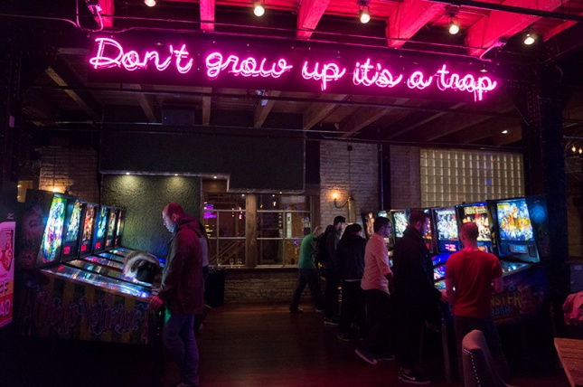 Patrons of Headquarters Beercade in River North test their reflexes with pinball machines.